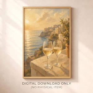 May include: A framed digital print of a coastal scene with two wine glasses filled with white wine. The artwork depicts a sunset over the sea, with a town on a cliffside. The text at the bottom reads "DIGITAL DOWNLOAD ONLY (NO PHYSICAL ITEM)".