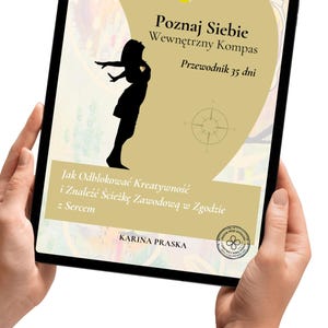 May include: A tablet screen displaying a book cover titled Poznaj Siebie Wewnętrzny Kompas Przewodnik 35 dni. The cover features a black silhouette of a person, a compass graphic, and the text Jak Odblokować Kreatywność i Znaleźć Ścieżkę Zawodową w Zgodzie z Sercem by Karina Praska.