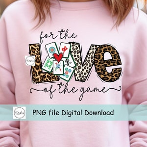 May include: Pink sweatshirt with a graphic design of the word "LOVE" with mahjong tiles inside the letters. The text "for the love of the game" is written below the graphic. The text "PNG file Digital Download" is written below the graphic.