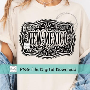 May include: Cream-colored t-shirt featuring a black and white decorative design with the words "NEW MEXICO" in a bold font. The design is framed by an ornate border. The text "PNG file Digital Download" is also visible.