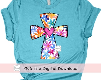 Op de afbeelding: Een turquoise T-shirt met een bloemenkruisontwerp. Het kruis is zwart omlijnd en gevuld met kleurrijke bloemen. Een roze hart bevindt zich in het midden van het kruis. De tekst "PNG file Digital Download" staat onderaan de afbeelding.