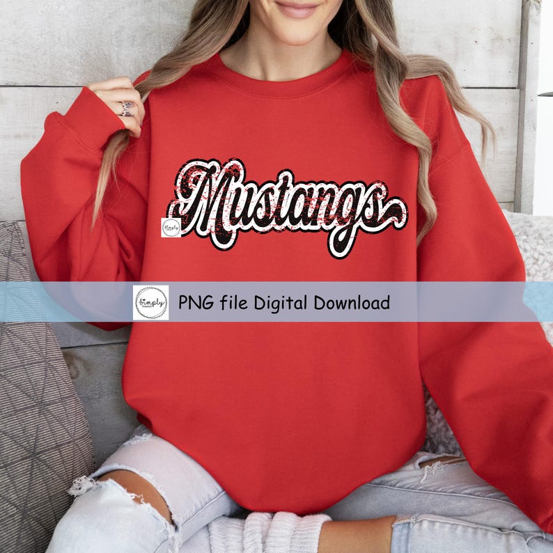 May include: Red sweatshirt with the text "Mustangs" in black and white with a glittery texture.
