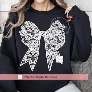 Puede incluir: Una sudadera negra con un dise&ntilde;o de lazo de encaje blanco. El texto "PNG file Digital Download" est&aacute; en la parte inferior de la imagen.