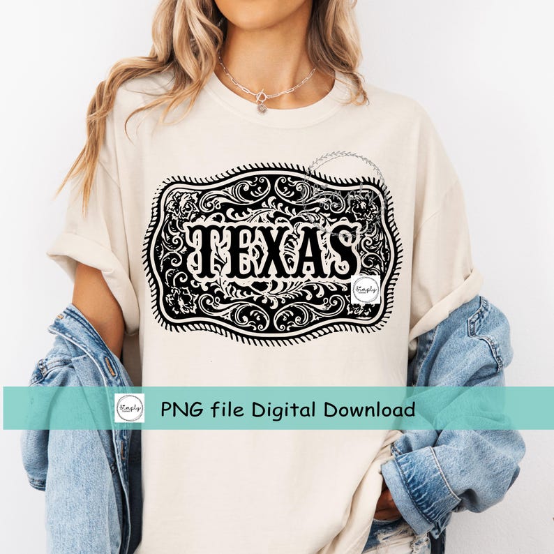 May include: Cream-colored t-shirt featuring a large, ornate black and white graphic of a belt buckle with the word "TEXAS" in bold letters. The design includes intricate scrollwork and a decorative border. The shirt also has the text "PNG file Digital Download".