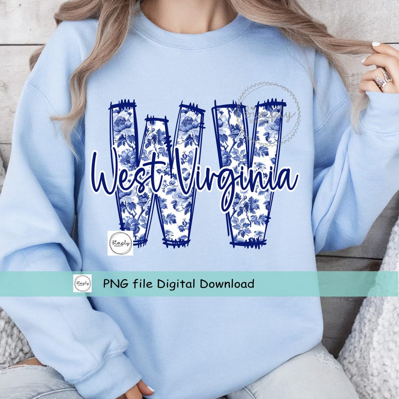 May include: A pale blue sweatshirt with the words "West Virginia" in dark blue script. The letters "WV" are filled with a blue floral pattern. A small logo and the text "PNG file Digital Download" are also visible.