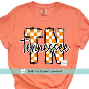 May include: Orange t-shirt with the word "Tennessee" in a cursive font over the letters "TN". The letters are outlined in black and filled with a white and orange checkered pattern. The shirt also says "PNG file Digital Download".