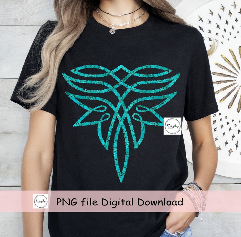 May include: A black t-shirt with a turquoise blue abstract design. The design is a geometric pattern with a cracked texture. The text "Simply" is in a white circle on the shirt.