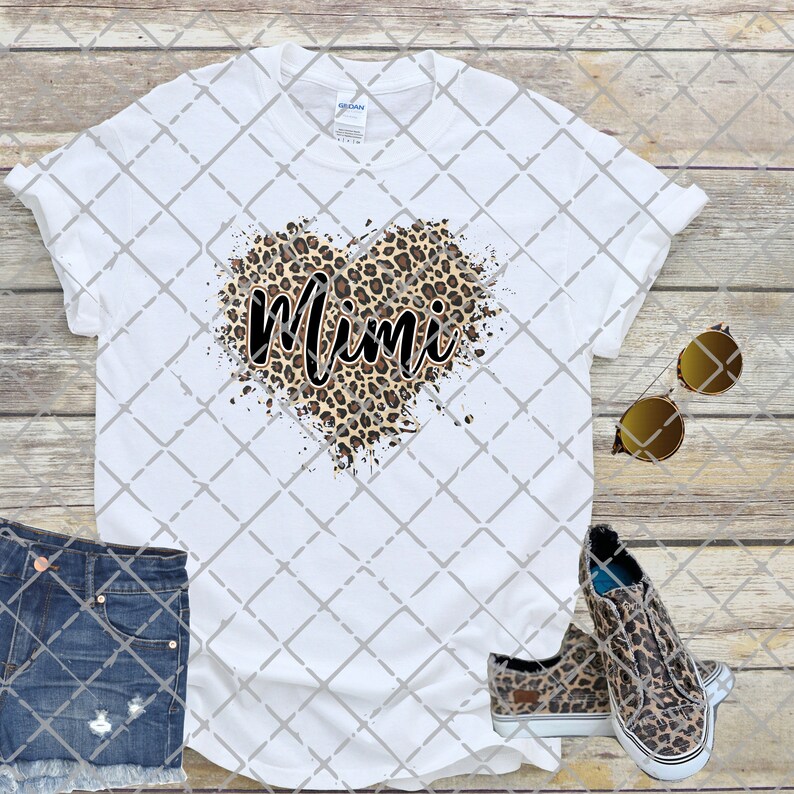 May include: White t-shirt with a leopard print heart and the word "Mimi" in black script.