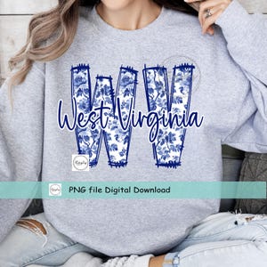May include: A light grey sweatshirt with the words "West Virginia" in a cursive font, and the letters "WV" filled with a blue floral pattern. The text "PNG file Digital Download" is also visible.