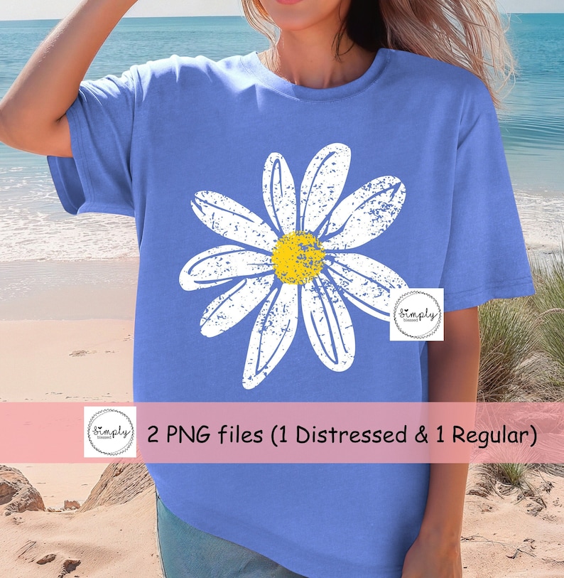 May include: A blue t-shirt with a white distressed daisy graphic. The daisy has a yellow center. The text "Simply Designed" is in a small circle on the bottom right corner of the shirt. 2 PNG files (1 Distressed & 1 Regular)