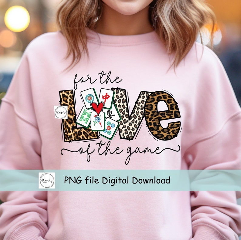 May include: Pink sweatshirt with a graphic design of the word "LOVE" with mahjong tiles inside the letters. The text "for the love of the game" is written below the graphic. The text "PNG file Digital Download" is written below the graphic.