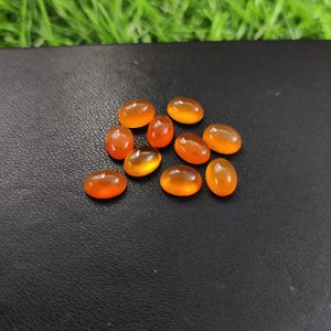 Cabujones ovalados de cornalina natural (10 unidades), piedras preciosas de base plana de 7 x 5 mm.