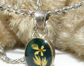 Small, delicate, round vintage pendant with a violet, circa 1950, with a long chain