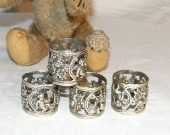 4x filigree vintage napkin rings made of SILVER 835/000, richly decorated with putti and roses