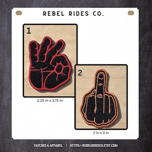 May include: Two embroidered patches with black and red designs. One patch shows a hand gesture with the fingers forming an "OK" sign, measuring 2.25 x 3.75 inches. The other patch displays a hand with the middle finger raised, measuring 2 x 3 inches. The text "REBEL RIDES CO." is at the top.