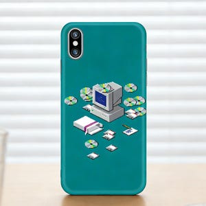 May include: Teal phone case featuring a pixelated computer design with CDs, a book, and papers. The retro computer has a blue screen and is surrounded by various digital media elements. The case is designed for a smartphone.