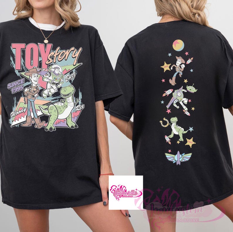 May include: Black t-shirt featuring Toy Story characters. The front graphic includes Woody, Buzz Lightyear, Rex, and the text "TOY STORY SINCE 1995". The back of the shirt has a vertical design with various characters and a moon.