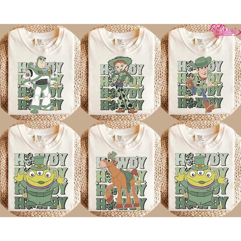 May include: Six off-white t-shirts featuring various Toy Story character graphics. Each shirt has a different character design, including Buzz Lightyear, Jessie, Woody, and others, with the text "Howdy" in green.