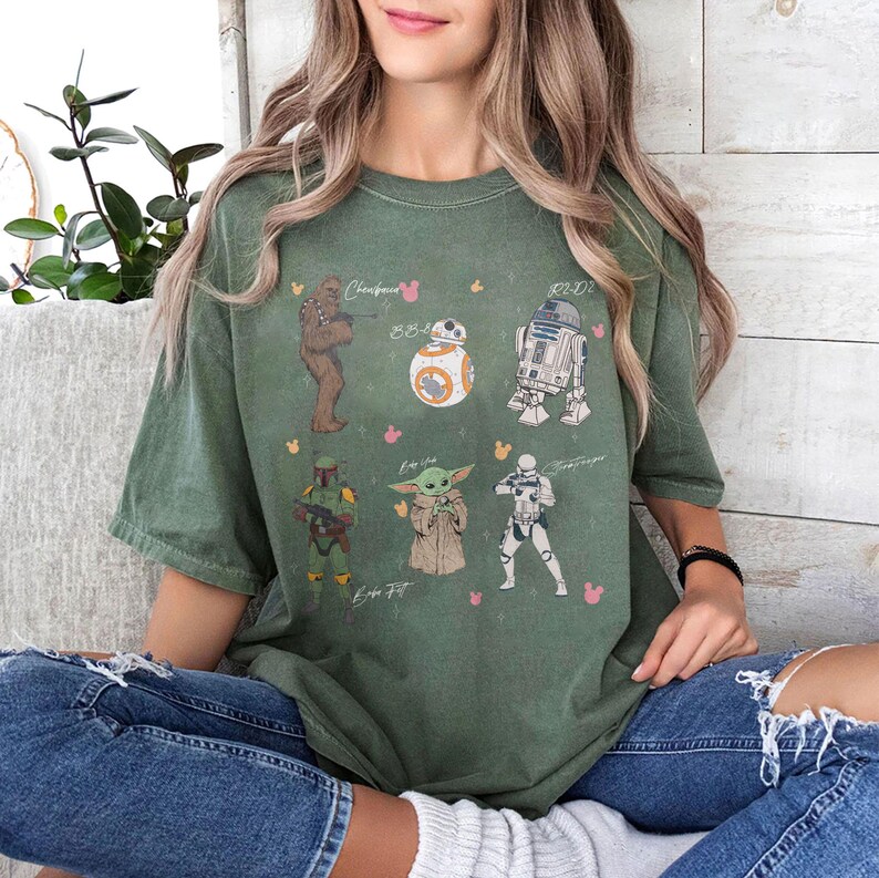 May include: A white ceramic mug with a black handle and the text "But First, Coffee" in a black, handwritten-style font. The mug is on a white surface.