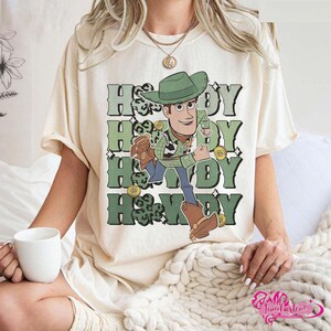 May include: A rustic wooden sign with the text "Welcome to our home" in white lettering. The sign features a distressed finish and a simple, inviting design, perfect for a front porch or entryway.