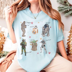 May include: A white ceramic mug with a black handle and the text "But first, coffee" in a handwritten style. The mug is on a white surface. Suitable for hot drinks.