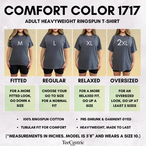 May include: Comfort Color 1717 adult heavyweight ringspun t-shirt size guide. Four images show a grey t-shirt in sizes M, L, XL, and 2XL with text labels for fitted, regular, relaxed, and oversized fits. Includes fabric details and model sizing info.