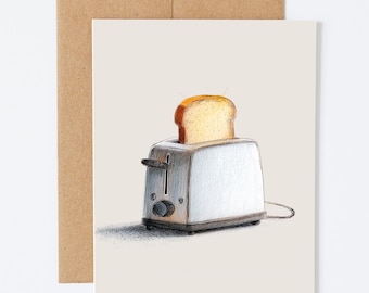 May include: A greeting card featuring a drawing of a retro-style toaster with a slice of toasted bread popping up. The toaster is silver and has a black lever and dial. The card is on a cream background with a brown envelope.