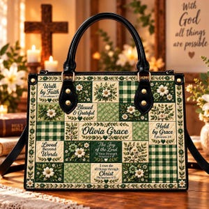 May include: A structured handbag featuring a patchwork design in shades of green and white. The pattern includes floral motifs, gingham checks, and text such as "Olivia Grace," "Walk by Faith," and "I can do all things through Christ."