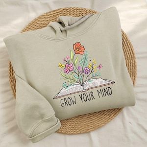 Grow your mind embroidery, open book with blooming flowers, inspirational reading design, floral literacy embroidery pattern