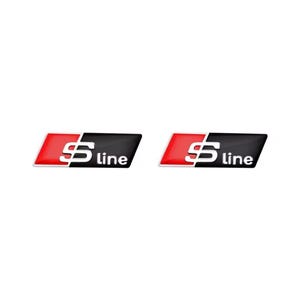 May include: Two S line car emblems. Each emblem features a red and silver S-shaped design on the left, transitioning to a black background with the word "line" in white. The emblems are rectangular with rounded edges.