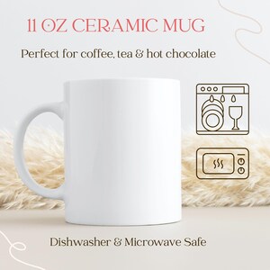 May include: A white ceramic mug with a curved handle. The mug is labeled "11 OZ CERAMIC MUG" and is dishwasher and microwave safe. The image also includes icons for a dishwasher and microwave.