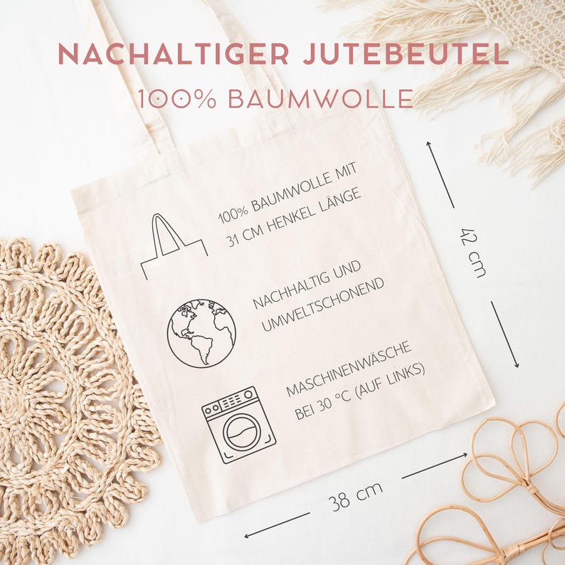 May include: A beige cotton tote bag featuring black line art icons and German text. The bag measures 42 cm in height and 38 cm in width. Details include a 31 cm handle length, sustainability information, and washing instructions for 30 degrees Celsius.