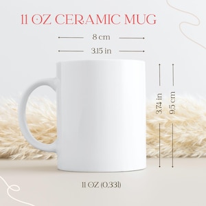 May include: A white ceramic mug with a curved handle. The mug is 3.74 inches (9.5 cm) tall and 3.15 inches (8 cm) in diameter. The text "11 OZ CERAMIC MUG" is displayed at the top of the image, and "11 OZ (0,33l)" is at the bottom.