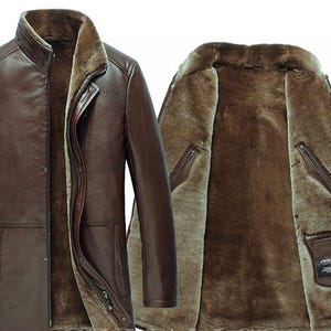 May include: A brown leather coat with a fur lining. The coat has a high collar, button closure, and multiple pockets. The interior is a lighter shade of brown, providing warmth and style. The coat is designed for cold weather.