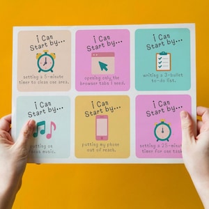 May include: A sheet of colorful square stickers with the text "I Can Start by..." and various productivity tips, including setting timers, writing to-do lists, and putting away phones. The sheet is held against a yellow background.