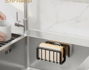 Organizador de fregadero con ventosa para esponjas y estropajos.