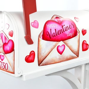 May include: White mailbox with a Valentine's Day theme. The mailbox has a red heart with the text "Happy Valentine's Day!" and a smaller envelope with a heart and the text "Thank you for all you do!"