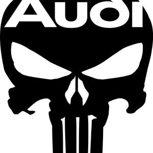 May include: A black and white graphic featuring a skull design with the word "Audi" in white block letters. The skull has stylized eye sockets, a nose, and vertical lines representing teeth.