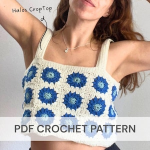 May include: Cream-colored crochet crop top with blue floral designs. The top has a square neckline and wide straps. The text "Halos CropTop" is written above the top, and the text "PDF CROCHET PATTERN" is written below the top.