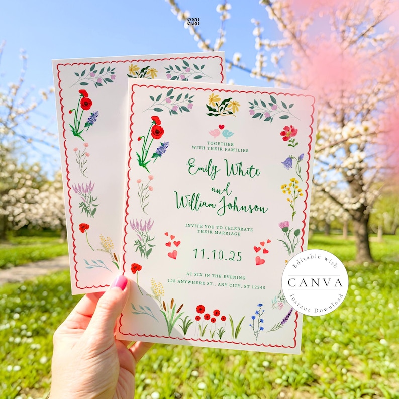 A beautiful wedding invitation card held against a scenic backdrop of blooming spring trees. The card features a scalloped red border with colorful illustrated wildflowers, including red poppies and lavender. It invites guests to celebrate the marriage of Emily White and William Johnson on November 10, 2025, at six in the evening. The charming design includes bird illustrations and a Canva watermark, set in an idyllic outdoor garden.