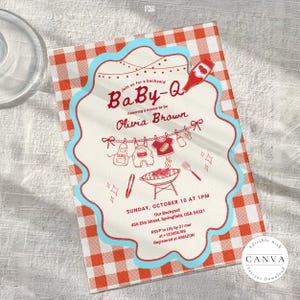 Baby-Q shower invitation on white wooden surface with red gingham border and light blue scalloped edge. Features clothesline with baby items and BBQ grill illustration. Invites guests to honor Olivia Brown, Sunday October 10 at 1PM, 456 Elm Street Springfield. RSVP to Lily by March 21. Editable Canva template shown with clear glass in corner.