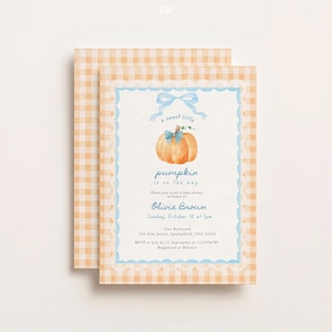 May include: A baby shower invitation card featuring a watercolor orange pumpkin with a blue bow, a blue ribbon graphic, and scalloped lace borders. The text reads: a sweet little pumpkin is on the way, Olivia Brown, Sunday, October 10, at 1pm.