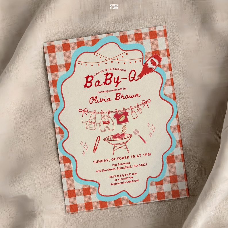 Baby-Q shower invitation on white fabric with red gingham border and turquoise scalloped frame. Features clothesline with baby items (sauce bottle, onesie, bib, bottle) and charcoal grill with spatula. Honors Olivia Brown, Sunday October 10 at 1PM, 456 Elm Street Springfield. RSVP to Lily by March 21. Registered at Amazon.