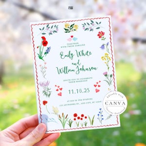 A wedding invitation card held against a backdrop of blooming spring trees. The card features a scalloped red border and colorful wildflowers, including red poppies and lavender. It invites guests to celebrate Emily White and William Johnson's marriage on November 10, 2025, at six in the evening. The design includes charming bird illustrations and a Canva watermark.