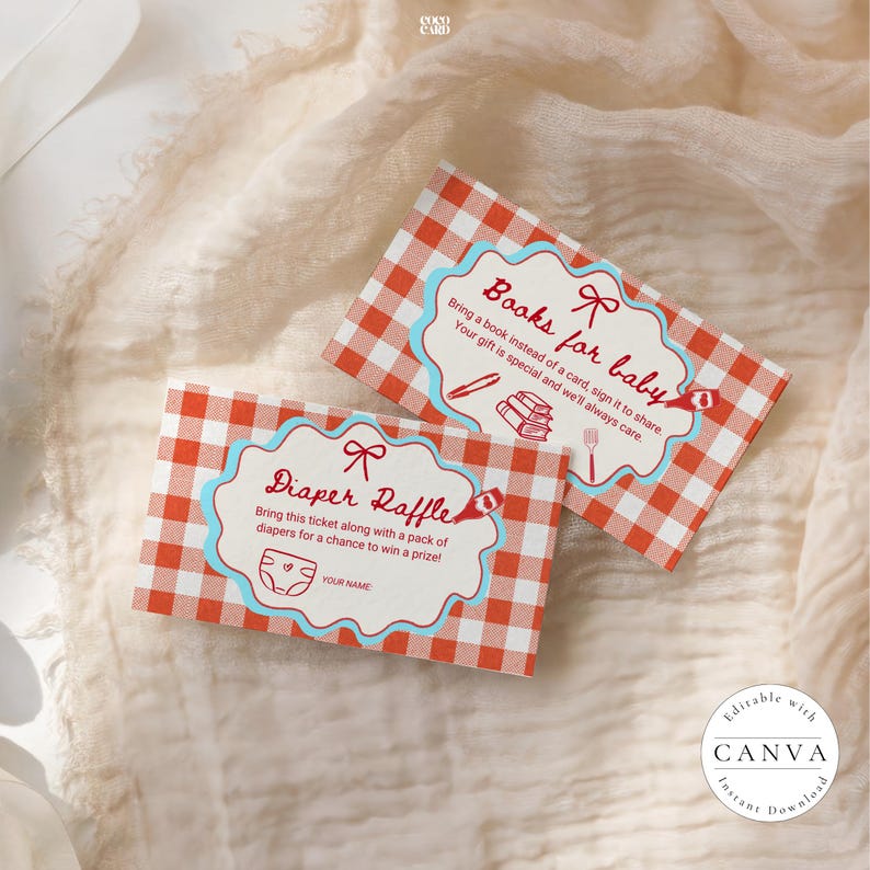 Two Baby-Q shower game cards on cream fabric with wooden background. Both feature red gingham pattern and blue scalloped borders with red bows. Left card shows "Diaper Raffle" with diaper icon and name field. Right card shows "Books for baby" with stacked books illustration. Editable Canva templates by Coco Card.