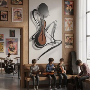 May include: A room with a large metal art piece depicting a woman playing a stringed instrument. Several children are seated on a wooden bench, holding violins. Vintage posters adorn the walls, and a drum set is visible in the background.