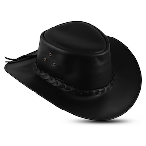 May include: A black leather cowboy hat with a braided band and three small rivets on the crown. The hat has a wide brim and a rounded crown. The hat is made of a smooth, shiny leather material.
