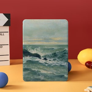 Könnte beinhalten: Ein Set aus drei Keramikbechern mit gesprenkelter, matter Oberfläche. Die Becher sind in Creme-, Hellgrau- und Dunkelgrautönen gehalten. Jeder Becher hat ein schlichtes, minimalistisches Design, ideal für Kaffee oder Tee.