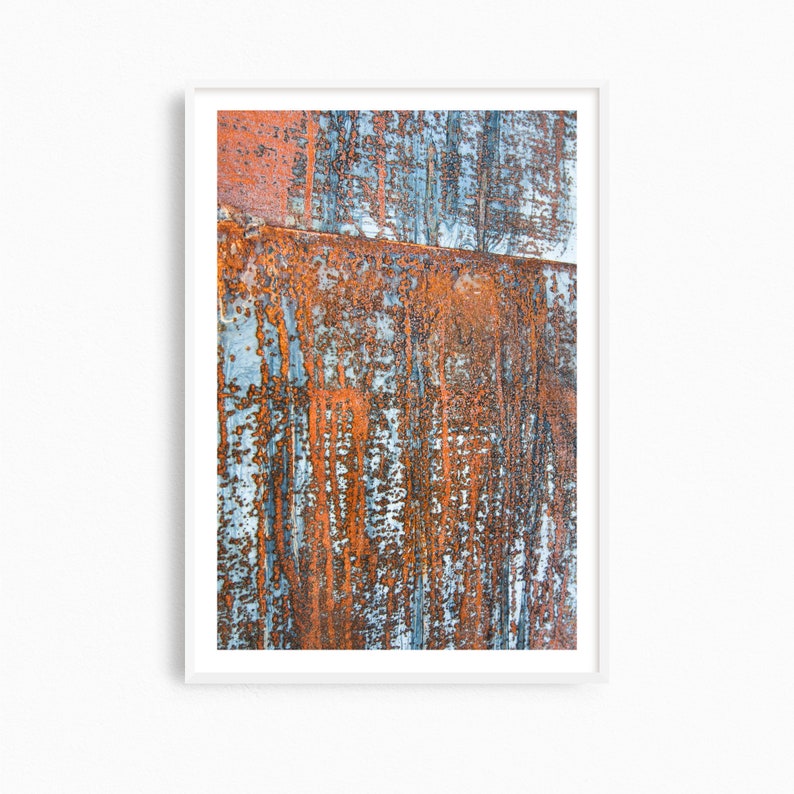 May include: Abstract art print featuring a close-up of a rusty metal surface with a blue and orange color scheme.