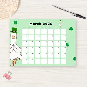 May include: A green March 2026 calendar featuring a cartoon goose wearing a green hat. The calendar has a light green background with white boxes for each day. Shamrock designs are scattered around the calendar.